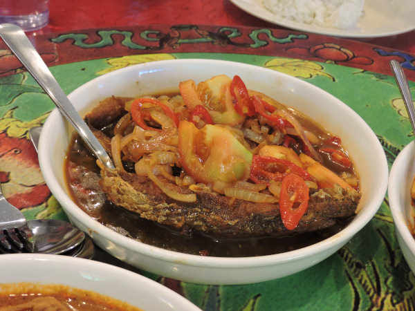 Chinese style fried fish with vinegar sauce and tomatoes Baba Charllie Cafe in Melaka Malaysia